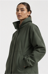 Model wearing a forest green technical jacket