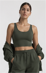 Model wearing a forest green cropped top and matching joggers