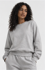 Model wearing a heather grey crewneck sweatshirt with matching shorts