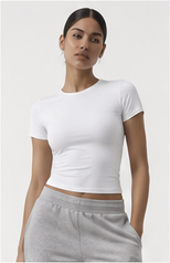 Model wearing a white fitted T-shirt with grey joggers