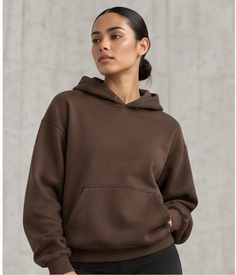 Model wearing the Relaxed Performance Hoodie in walnut brown, front view