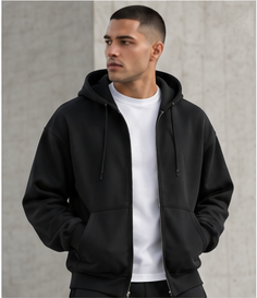Model wearing the Travel Zip Hoodie in black over a white T-shirt, front view