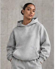 Model wearing the Signature Heavyweight Hoodie in heather grey, front view