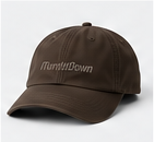 Core Performance Cap in walnut brown, photographed on its own