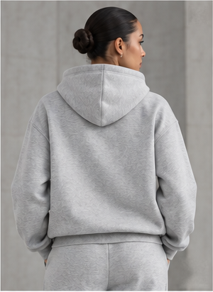 Model wearing the Signature Heavyweight Hoodie in heather grey, back view