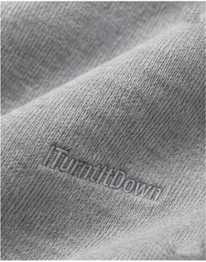 Close up of the tonal embroidered ITurntItDown branding on heather grey fleece