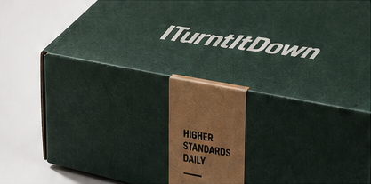 An ITurntItDown shipping box with a kraft band reading Higher Standards Daily